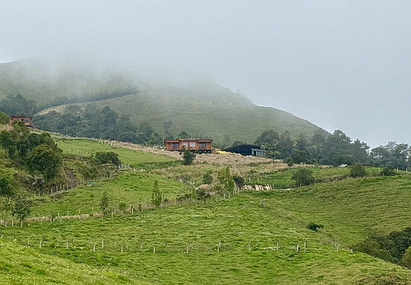 Our next lodge, Hacienda El Bosque, was at 10,000 feet. Although the weather was chilly and sometimes foggy it was one of our favorite places. (Our cabins are in the center of the photo.)