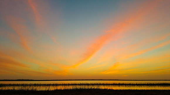Sunrise over lagoon at Crooked Tree Lodge