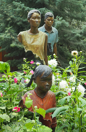 Bronze sculpture depicting traveling family, Flower Dome Conservatory, Gardens by the Bay